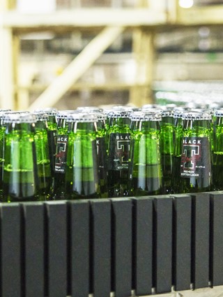 Bottles on a conveyor belt at Tennents' Wellpark facility